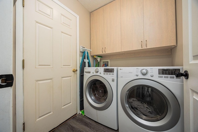 3409 Marl Pl, Columbus, OH 43221 - laundry area featuring cabinet space, independent washer and dryer, and dark wood-style flooring