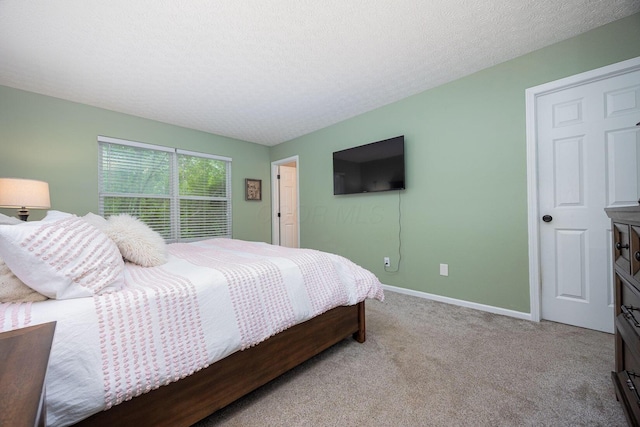3409 Marl Pl, Columbus, OH 43221 - bedroom featuring light carpet, baseboards, and a textured ceiling