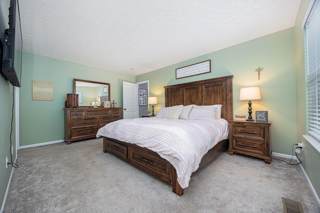 3409 Marl Pl, Columbus, OH 43221 - bedroom featuring light colored carpet, baseboards, and a textured ceiling