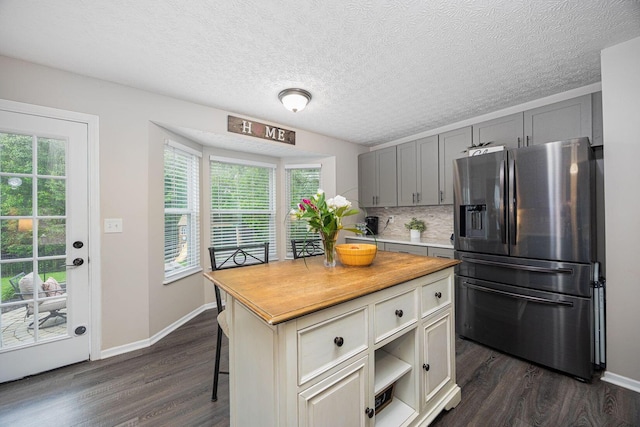 3409 Marl Pl, Columbus, OH 43221 - kitchen with stainless steel fridge with ice dispenser, dark wood-style floors, and plenty of natural light