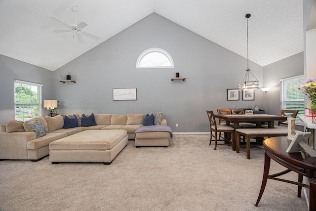 3409 Marl Pl, Columbus, OH 43221 - living area featuring high vaulted ceiling, light colored carpet, a ceiling fan, and baseboards