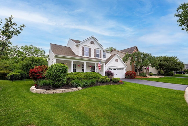 3409 Marl Pl, Columbus, OH 43221 - traditional-style home featuring asphalt driveway, a front yard, and a porch