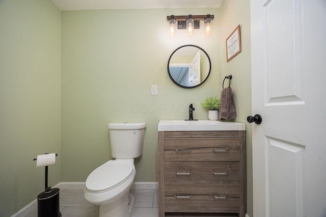 3409 Marl Pl, Columbus, OH 43221 - bathroom with toilet, vanity, baseboards, and tile patterned floors