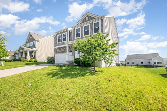 2357 Pine Crest Dr, Lancaster, OH 43130 - view of front of property with a garage, driveway, stone siding, and central air condition unit