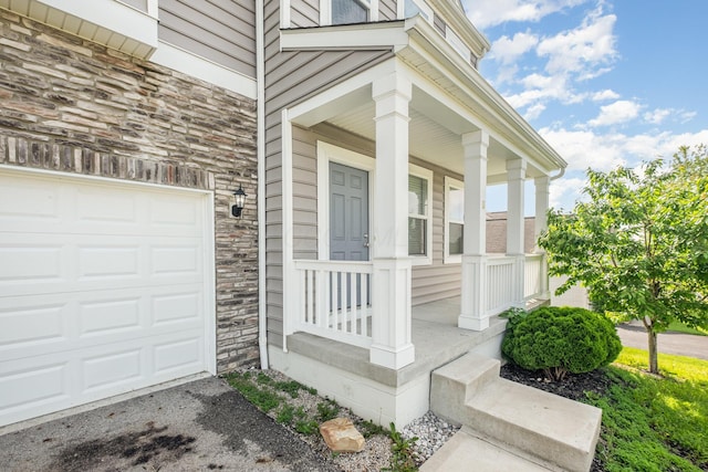 2357 Pine Crest Dr, Lancaster, OH 43130 - view of exterior entry with stone siding and a porch
