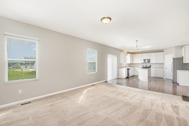 2357 Pine Crest Dr, Lancaster, OH 43130 - unfurnished living room with carpet and baseboards