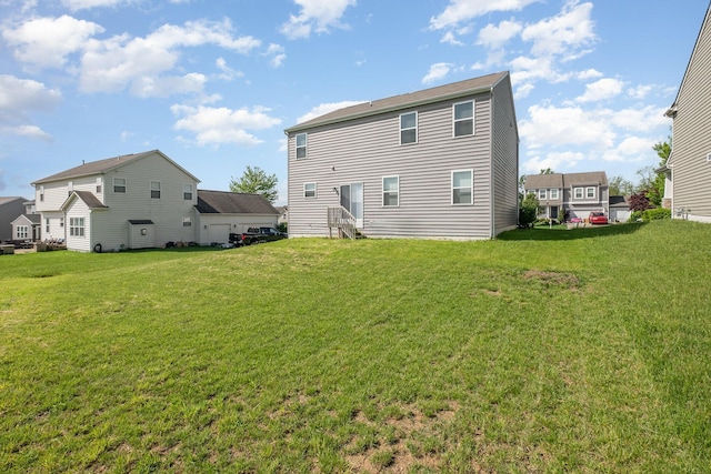 2357 Pine Crest Dr, Lancaster, OH 43130 - rear view of property with a lawn and entry steps