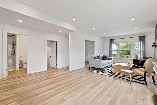 1104 E Whittier St, Columbus, OH 43206 - living area featuring light wood finished floors, recessed lighting, and baseboards