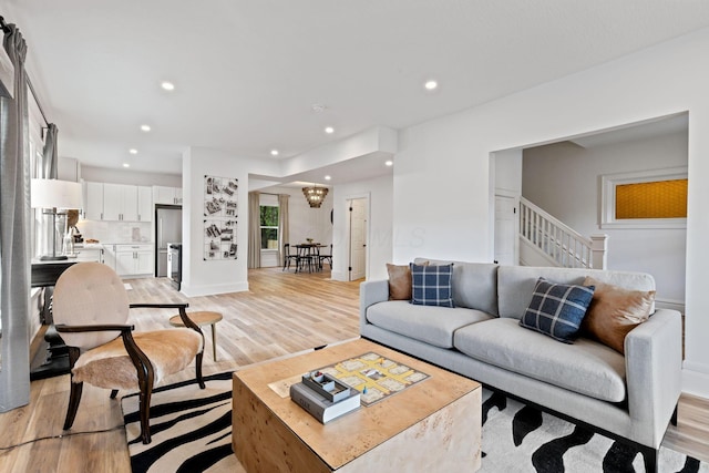 1104 E Whittier St, Columbus, OH 43206 - living area featuring light wood-type flooring, recessed lighting, and stairs