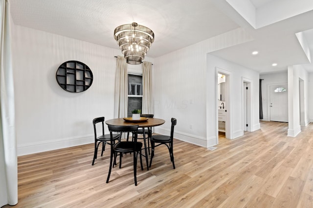 1104 E Whittier St, Columbus, OH 43206 - dining area featuring baseboards, light wood-style flooring, a chandelier, and recessed lighting