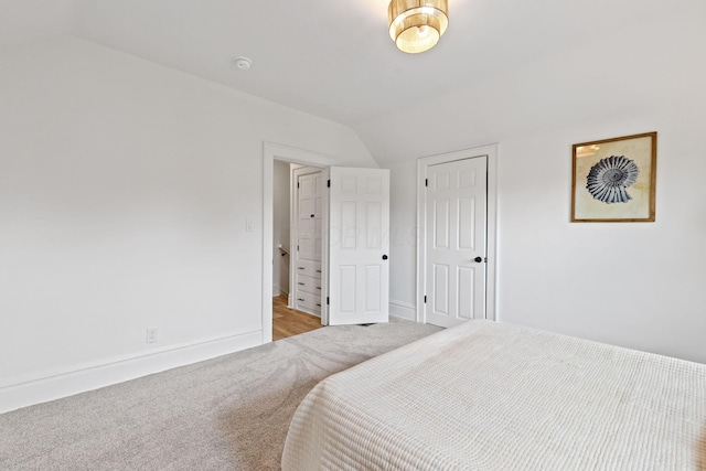 1104 E Whittier St, Columbus, OH 43206 - bedroom with lofted ceiling, carpet, and baseboards