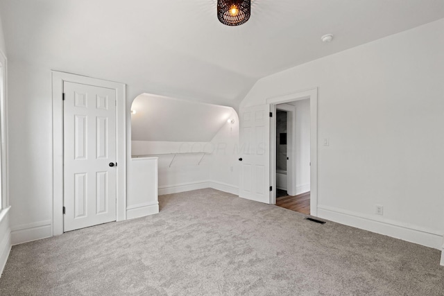 1104 E Whittier St, Columbus, OH 43206 - additional living space with carpet flooring, vaulted ceiling, and baseboards