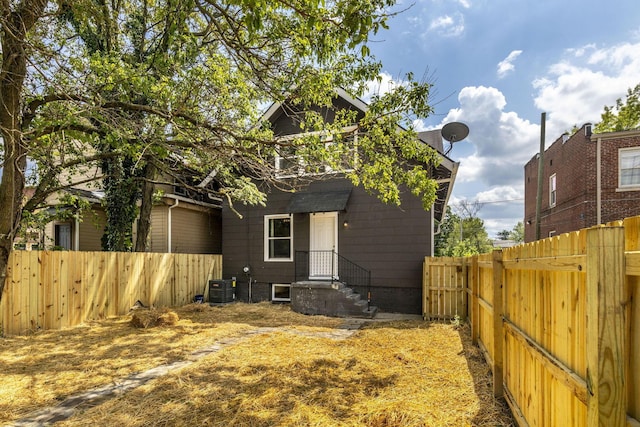 1104 E Whittier St, Columbus, OH 43206 - back of house featuring a fenced backyard and central AC