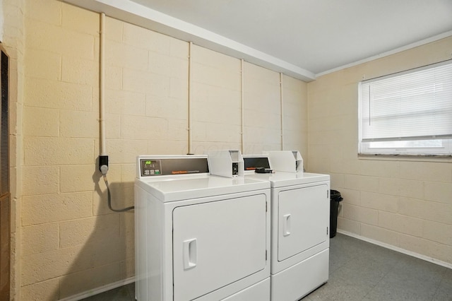 1470 King Ave, Columbus, OH 43212 - community laundry room featuring washing machine and clothes dryer, concrete block wall, and ornamental molding