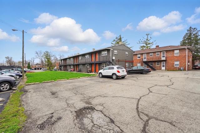 1470 King Ave, Columbus, OH 43212 - view of property with uncovered parking and stairs