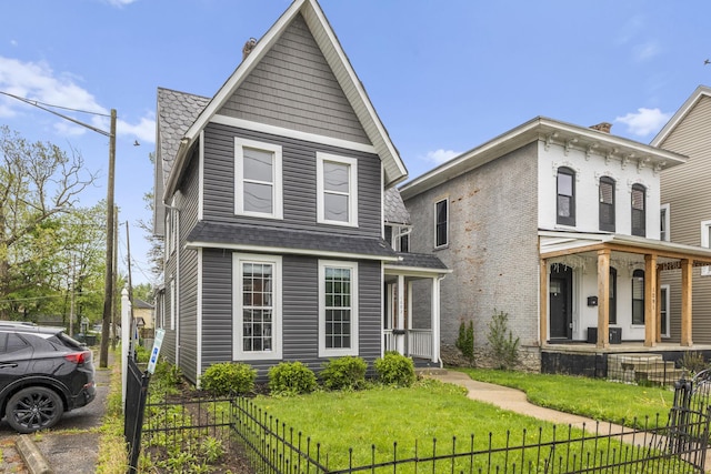 1093 E Long St, Columbus, OH 43203 - view of front facade featuring covered porch and a shingled roof