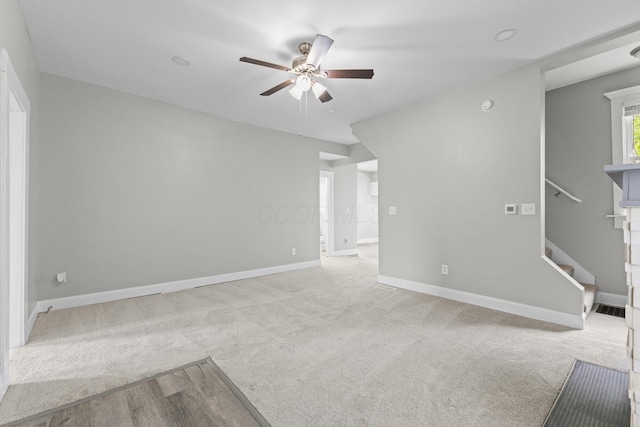 1093 E Long St, Columbus, OH 43203 - unfurnished room with a ceiling fan, carpet floors, baseboards, and stairway