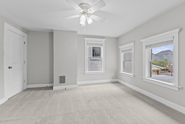 1093 E Long St, Columbus, OH 43203 - empty room featuring carpet, baseboards, and ceiling fan