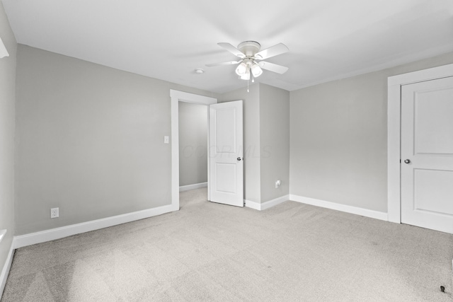1093 E Long St, Columbus, OH 43203 - unfurnished bedroom with carpet, baseboards, and ceiling fan