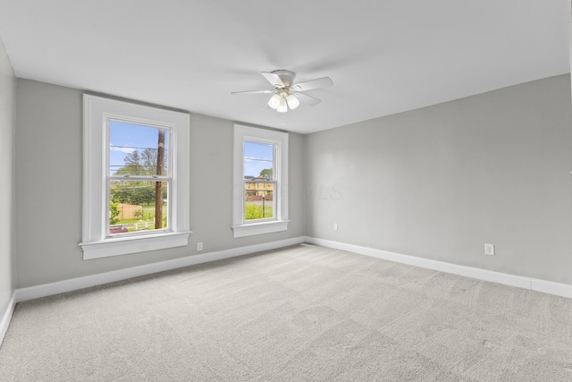 1093 E Long St, Columbus, OH 43203 - empty room featuring a ceiling fan, baseboards, and carpet