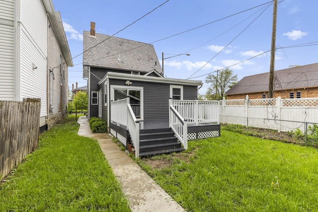 1093 E Long St, Columbus, OH 43203 - rear view of house with a deck and a chimney