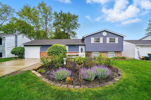 1008 London Rd, West Jefferson, OH 43162 - tri-level home with brick siding, a garage, driveway, and a front lawn