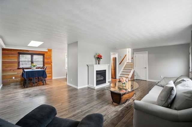 1008 London Rd, West Jefferson, OH 43162 - living room with a fireplace, baseboards, a skylight, stairs, and wood finished floors