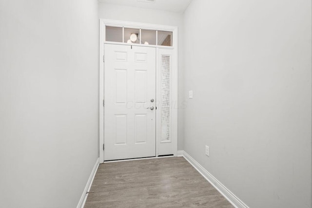 5165 Hamptonshire Dr, Dublin, OH 43016 - doorway featuring wood finished floors and baseboards