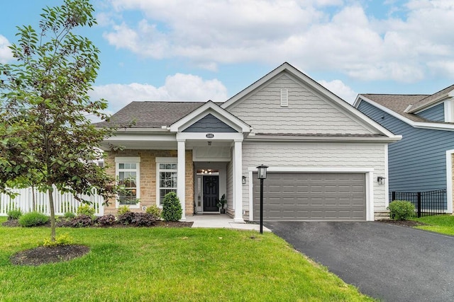 5165 Hamptonshire Dr, Dublin, OH 43016 - craftsman inspired home featuring asphalt driveway and a garage