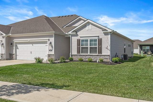 759 Abby Dr, Plain City, OH 43064 - view of front of house featuring a garage, a front lawn, concrete driveway, stone siding, and roof with shingles