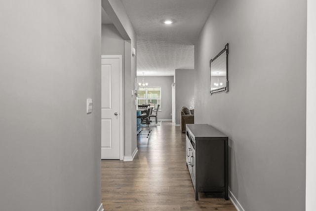 759 Abby Dr, Plain City, OH 43064 - corridor featuring baseboards, a chandelier, and wood finished floors