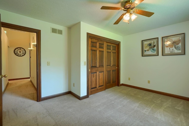 3695 Britton Ave, Columbus, OH 43204 - unfurnished bedroom with carpet floors, baseboards, a closet, ceiling fan, and a textured ceiling