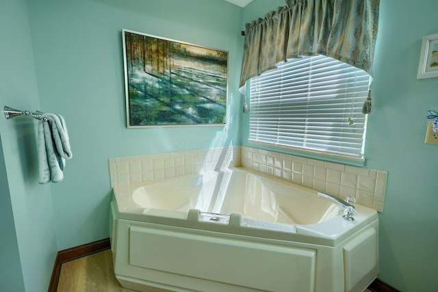 3695 Britton Ave, Columbus, OH 43204 - full bathroom featuring a bath and baseboards