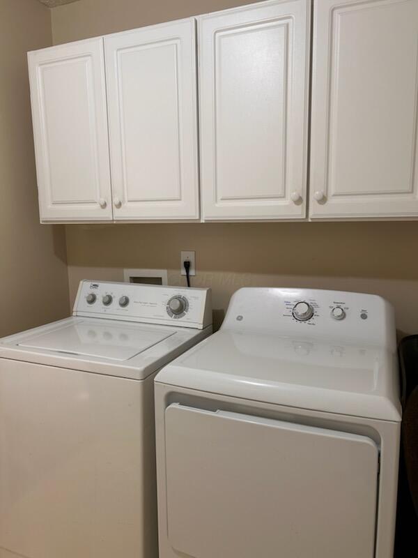 6855 Falcon Ln Unit 4A, Canal Winchester, OH 43110 - laundry room with washing machine and dryer and cabinet space