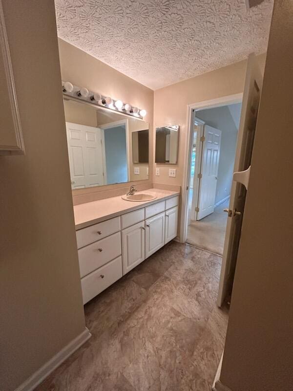 6855 Falcon Ln Unit 4A, Canal Winchester, OH 43110 - bathroom featuring vanity and a textured ceiling