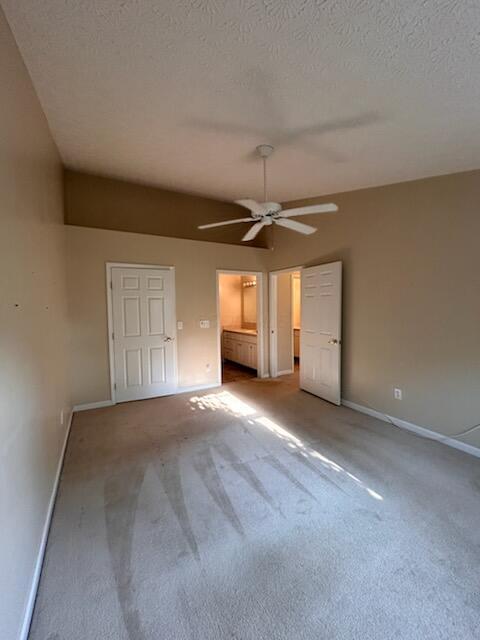 6855 Falcon Ln Unit 4A, Canal Winchester, OH 43110 - unfurnished bedroom with baseboards, carpet flooring, a textured ceiling, and ceiling fan