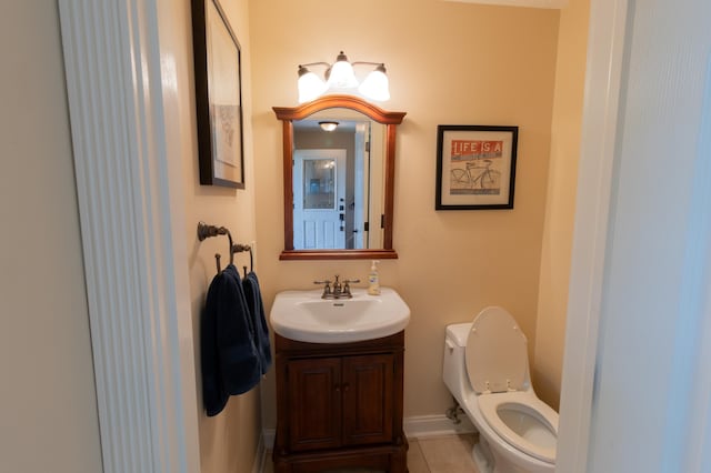 5392 Ponderosa Dr, Columbus, OH 43231 - half bathroom featuring toilet, vanity, and tile patterned flooring