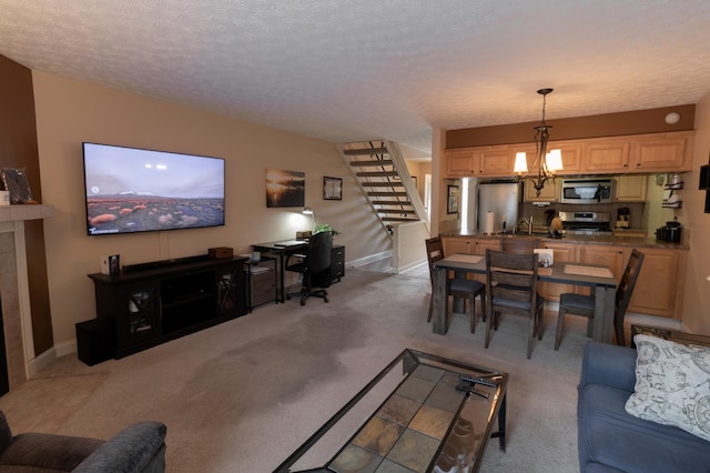 5392 Ponderosa Dr, Columbus, OH 43231 - living room featuring stairway, a chandelier, light colored carpet, and baseboards