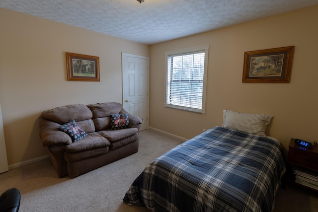 5392 Ponderosa Dr, Columbus, OH 43231 - bedroom featuring carpet flooring, baseboards, and a textured ceiling