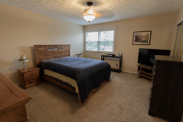 5392 Ponderosa Dr, Columbus, OH 43231 - bedroom featuring a textured ceiling, light colored carpet, and a ceiling fan