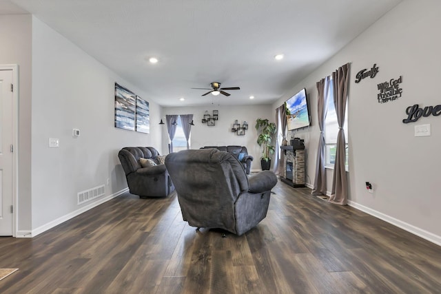 4196 Holstein Dr, Obetz, OH 43207 - living room with a ceiling fan, dark wood finished floors, baseboards, recessed lighting, and a stone fireplace