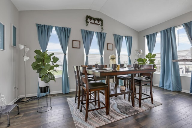 4196 Holstein Dr, Obetz, OH 43207 - dining room featuring vaulted ceiling, healthy amount of natural light, dark wood-style floors, and baseboards
