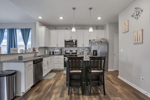 4196 Holstein Dr, Obetz, OH 43207 - kitchen featuring appliances with stainless steel finishes, a sink, backsplash, white cabinetry, and recessed lighting