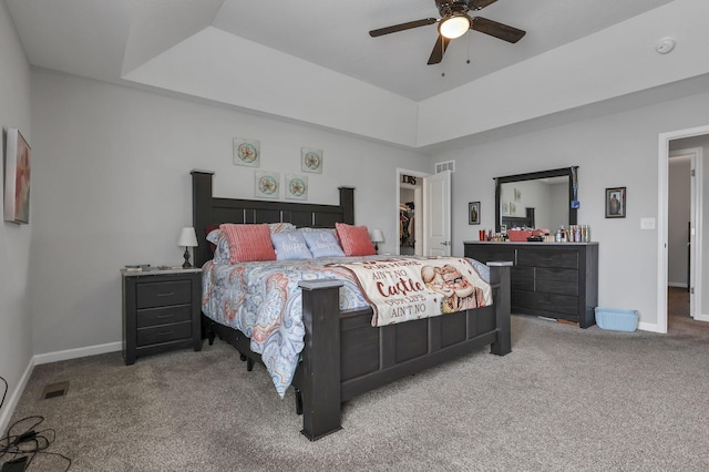 4196 Holstein Dr, Obetz, OH 43207 - bedroom featuring carpet flooring, baseboards, a spacious closet, a tray ceiling, and ceiling fan
