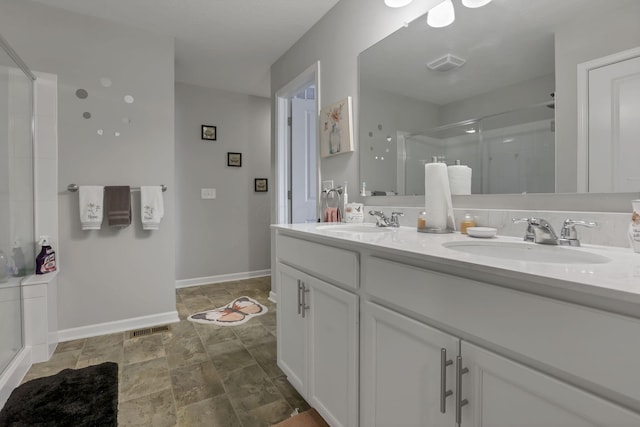 4196 Holstein Dr, Obetz, OH 43207 - bathroom featuring a shower stall, baseboards, and double vanity