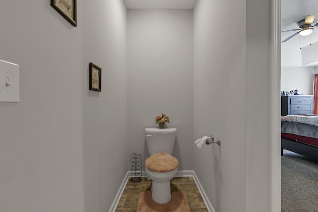 4196 Holstein Dr, Obetz, OH 43207 - bathroom featuring connected bathroom, toilet, ceiling fan, and baseboards