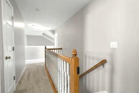 6004 Goldstone Dr, Grove City, OH 43123 - hall featuring an upstairs landing, carpet flooring, and baseboards