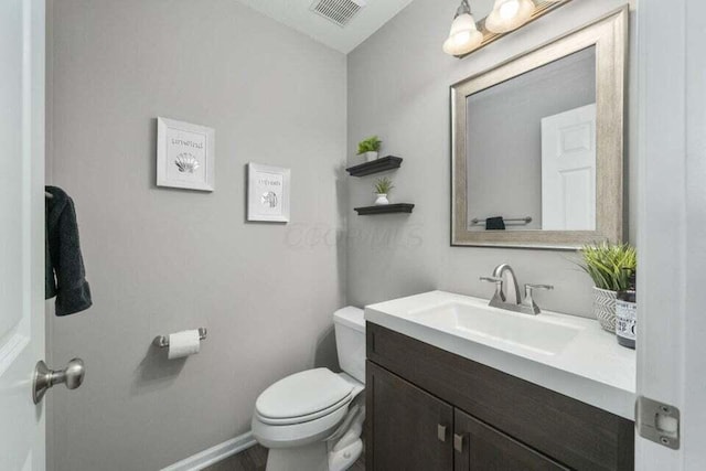 6004 Goldstone Dr, Grove City, OH 43123 - half bathroom with toilet, vanity, and baseboards