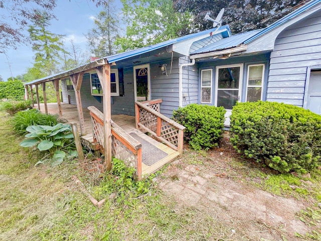 16251 State Route 678, Rockbridge, OH 43149 - property entrance with a deck and metal roof