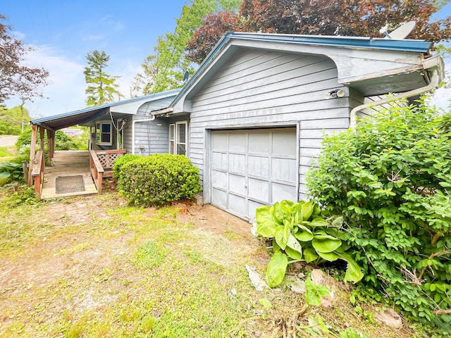 16251 State Route 678, Rockbridge, OH 43149 - view of front of property with an attached garage and a deck
